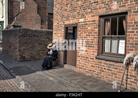 Black Country Museum Dudley. Woman traditionally dressed in 1900's period costume West Midlands England UK Stock Photo