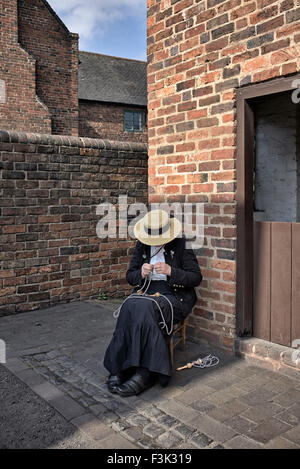 Black Country Museum Dudley. Woman traditionally dressed in 1900's period costume West Midlands England UK Stock Photo