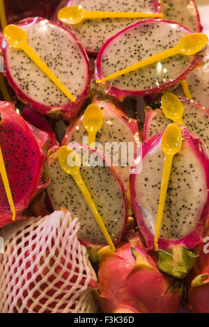 Cross section of a ripe white pitahaya wrapping in Cling film 'Hylocereus undatus ' Stock Photo