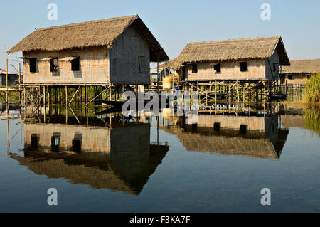 Reflection of wooden stilted houses on Inle Lake, Shan State, Myanmar