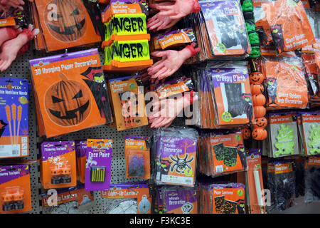 A pound discount store with £1 signs & Halloween scary discounted goods on racks or shelves, Southport, Merseyside, UK Stock Photo