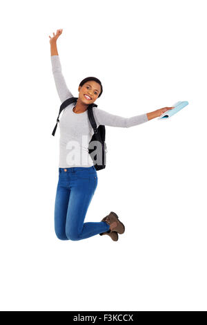 Happy female student with backpack jumping isolated on white background ...