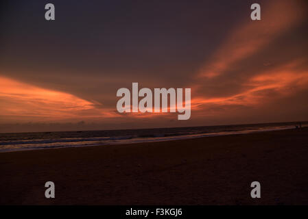 Sunset over ocean and beach in Kerala India.Bekal fort beach Kasargode.Beach,cloud,flat,horizon,india,indian,kerala,ocean Stock Photo