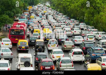 Many cars and busses are cought in a traffic jam on a main highway in New Delhi just after a heavy monsoon rainfall Stock Photo