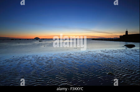 Girvan Harbour at Sunset with the isle of Ailsa Craig in the background Stock Photo