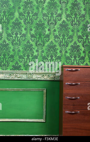 Living room with green vintage pattern. Rich retro vintage pattern on old wall Stock Photo