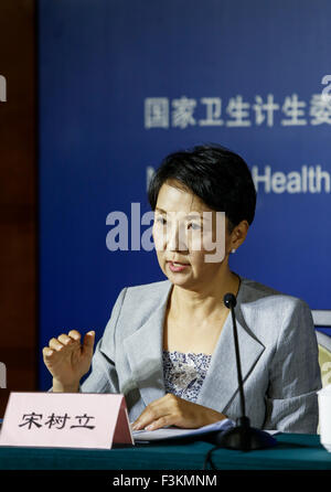 (151009) -- BEIJING, Oct. 9, 2015 (Xinhua) -- Song Shuli, spokesperson of the National Health and Family Planning Commission of China, answers questions during a press conference on the work of mental health in China in Beijing, capital of China, Oct. 9, 2015. (Xinhua/Shen Bohan)(wjq) Stock Photo