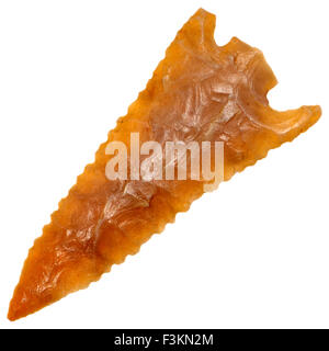 Early Bronze age flint arrowhead (Saharan Africa, c3000BC) 36mm long - 'Barbed and Tanged' style Stock Photo