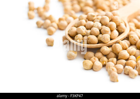 uncooked chickpeas in wooden spoon on white background Stock Photo