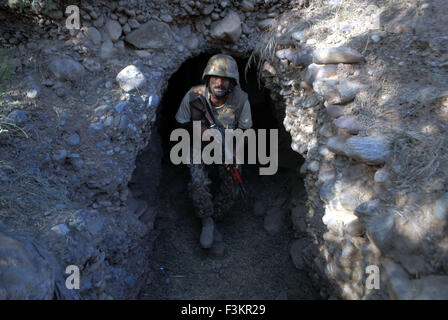 Khyber Agency. 8th Oct, 2015. A soldier walks out of a hidden tunnel used by terrorists in northwest Pakistan's Khyber Agency, Oct. 8, 2015. Arms, ammunitions and explosive materials have been recovered during intelligence-based operations in Khyber Agency, officials said. © Umar Qayyum/Xinhua/Alamy Live News Stock Photo