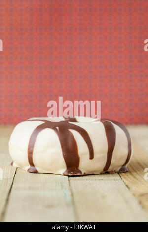 donut with glaze on colorful retro background Stock Photo
