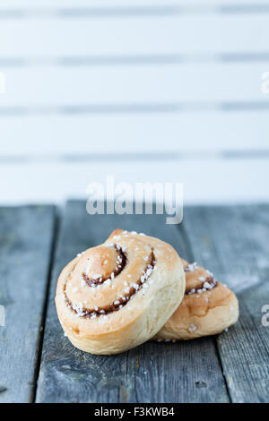 cinnamon buns on dark wooden background Stock Photo