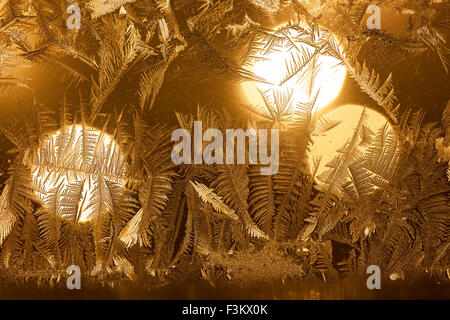 Rime on window and christmas light on background Stock Photo
