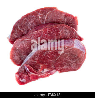 Aerial of raw red meat steaks isolated against a white background Stock Photo