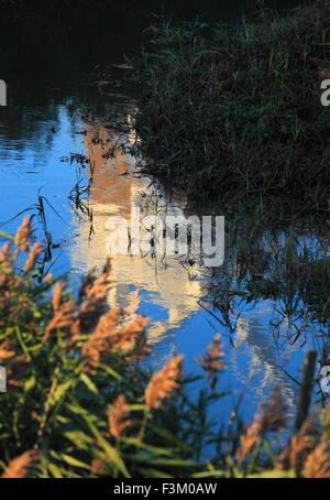 Cley Windmill at Cley next the Sea on the North Norfolk coast reflection in the River Glaven. Stock Photo