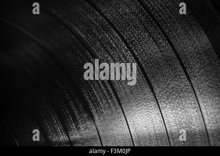 Background texture of black vinyl record, selective focus shallow DOF Stock Photo