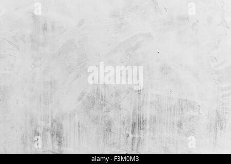 Concrete wall with whitewash layer, background photo texture Stock Photo