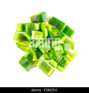 Isolated aerial of green capsicum chopped up into pieces Stock Photo