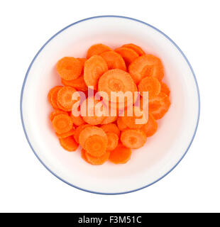 Freshly cut round carrot pieces in a bowl isolated on white Stock Photo