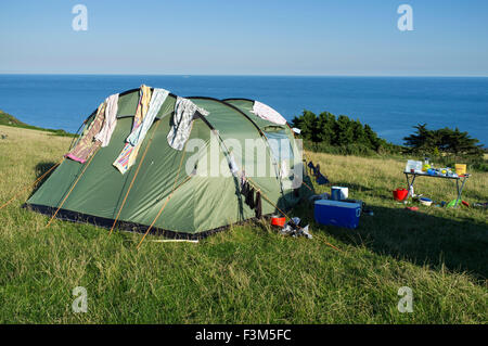 Camping on a field overlooking the sea at East Prawle, Devon. Stock Photo