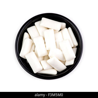 Bowl with pieces of tasty white chewing gum Stock Photo