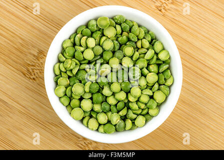 Green split peas in bowl Stock Photo