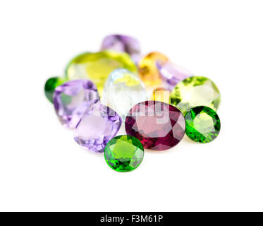 Peridot, amethyst, rhodolite, apatite, sphene, and chrome diopside gemstones isolated on white Stock Photo