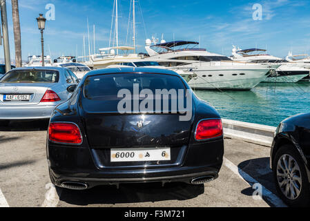 A Car Parked Near A Pier By The Sea I ts A Sunny Day And The Sky Is a-car-parked-near-a-pier-by-the-sea-i-ts-a-sunny-day-and-the-sky-is