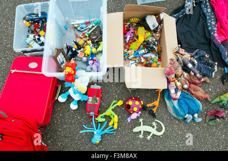 Assorted Items in close up flea market items spread on blanket/pavement Stock Photo