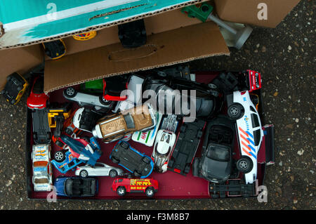 Assorted Items in close up flea market items spread on blanket/pavement Stock Photo