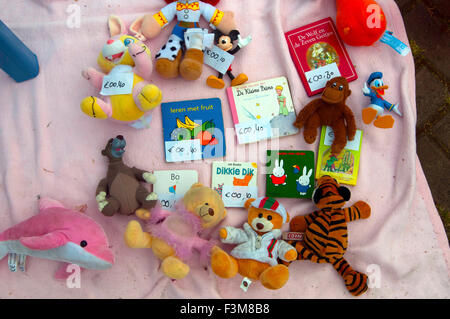 Assorted Items in close up flea market items spread on blanket/pavement Stock Photo