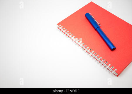 Notebook and pen isolated on white background Stock Photo