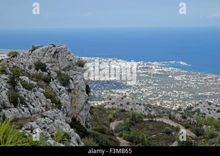 Looking down on the coastal town of Kyrenia from a high rocky outcrop view in the Besparmak mountain landscape in North Cyprus  KATHY DEWITT Stock Photo