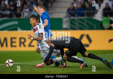 Essen, Germany. 9th Oct, 2015. Germany's Davie Selke (l) in action with Finnland's goalie Otso Virtanen (r) and Finnlands Daniel O`Shaughnessy (M) during the European Championships Qualification U-21 - Group 7 match between Germany and Finland in Essen, Germany, 9 October 2015. Photo: GUIDO KIRCHNER/DPA/Alamy Live News Stock Photo