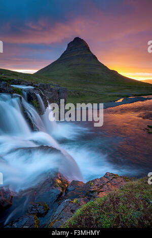 Dawn over Kirkjufell mountain and waterfall, Grundarfjordur, Snaefellsnes Peninsula, Vesturland, Iceland. Stock Photo