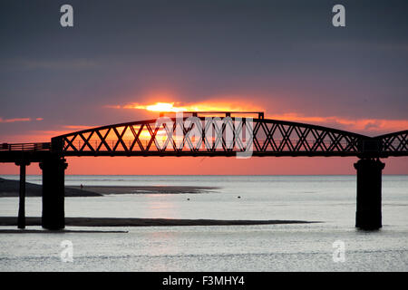 Barmouth Bridge at sunset Gwynedd Mid Wales UK Stock Photo