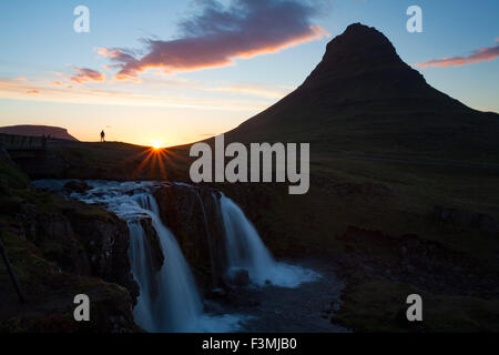 Sunset over Kirkjufell mountain and waterfall, Grundarfjordur, Snaefellsnes Peninsula, Vesturland, Iceland. Stock Photo