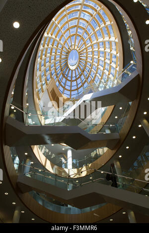 A picture showing the modern interior of Liverpool's Library, with its glass centred roof which illuminates the central foyer Stock Photo