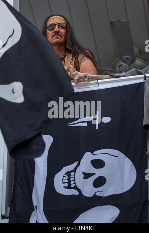 Tybee Island, Georgia, USA. 09th Oct, 2015. A costumed pirate watches events during the annual three-day Tybee Island Pirate Festival October 9, 2015 in Tybee Island, Georgia. Stock Photo