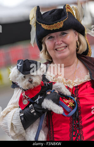 Tybee Island, Georgia, USA. 09th Oct, 2015. A costumed pirate poses with her pirate puppy during the annual three-day Tybee Island Pirate Festival October 9, 2015 in Tybee Island, Georgia. Stock Photo