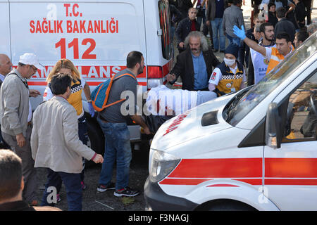 Ankara, Turkey, 10th Oct, 2015. A wounded man is transfered to an ambulance at the accident site in Ankara, capital of Turkey, on Oct. 10, 2015. At least 30 were killed and 126 others injured on Saturday after two explosions in the Turkish capital of Ankara, Turkish Interior Ministry said. Credit:  Cihan/Xinhua/Alamy Live News Stock Photo