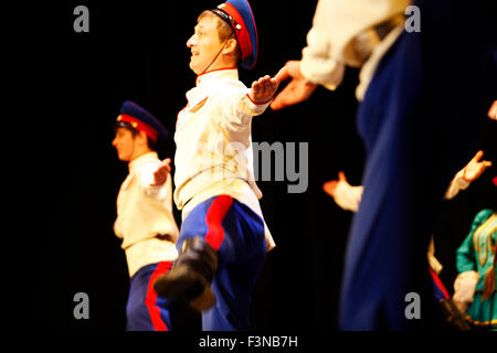 Russian Cossack folk tradition dancers performing live on stage during an entertainment evening show in Myrina city's auditorium 'MAROYLA', Limnos, GR Stock Photo