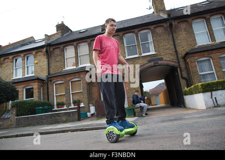 'Hoverboard' scooters being ridden by teenage boys, London, England, UK Stock Photo