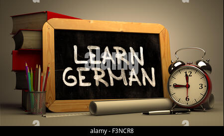 Learn German Concept Hand Drawn on Chalkboard. Stock Photo