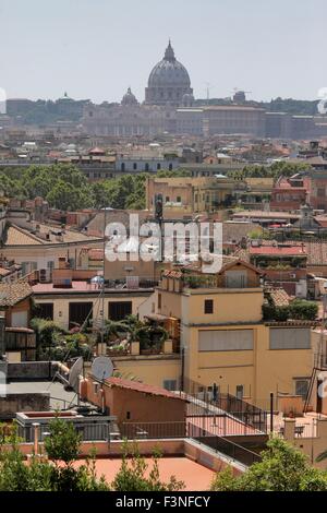 Rome, Italy. 16th July, 2015. View of the St. Peter's Basilica in the Vatican towering over the rooftops of Rome, Italy, 16 July 2015. Photo: Fredrik von Erichsen/dpa - NO WIRE SERVICE -/dpa/Alamy Live News Stock Photo