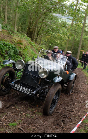 New Radnor, Powys, Wales - Saturday 10th October 2015 - The Vintage Sports Car Club ( VSCC ) hill climb trial challenge on The Smatcher a steep wooded hill just outside New Radnor. Competitors score points the further they drive up the steep hill with 25 points being awarded for reaching the top. The passengers act as 'bouncers' who bounce to help the car grip on the steep sections. Shown here is car #252 a Chrysler 66 Sports from 1930. Stock Photo
