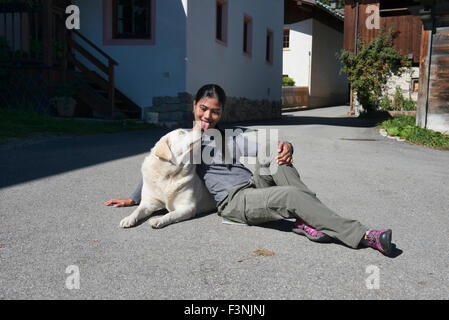 Woman's best friend; at play with a labrador retriever, Santa Lucia, Italy Stock Photo