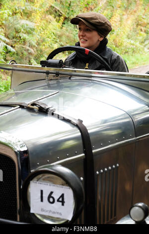New Radnor, Powys, Wales - Saturday 10th October 2015 - The Vintage Sports Car Club ( VSCC ) hill climb trial challenge on The Smatcher a steep wooded hill just outside New Radnor.  Shown here is a 1930 AJS 2 Seater Sports driven by Alexandra Milne-Taylor. Stock Photo