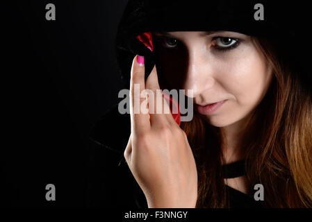 woman in black hood Stock Photo