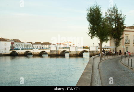 Tavira cityscape from the right bank of the gilao river during a summer sunset. Horizontal Stock Photo